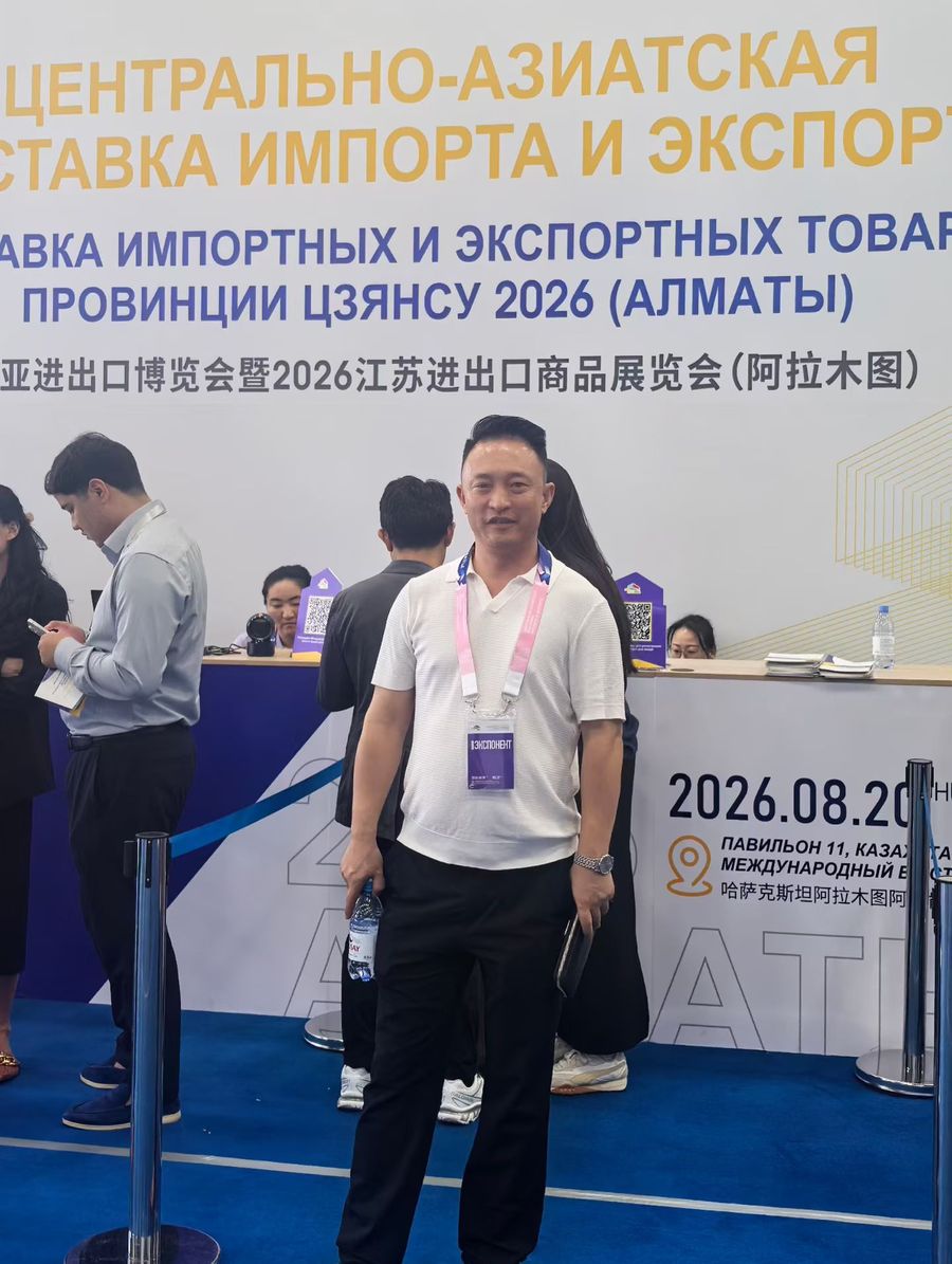 Company representative at the entrance of the Central Asia Import & Export Expo in Almaty
